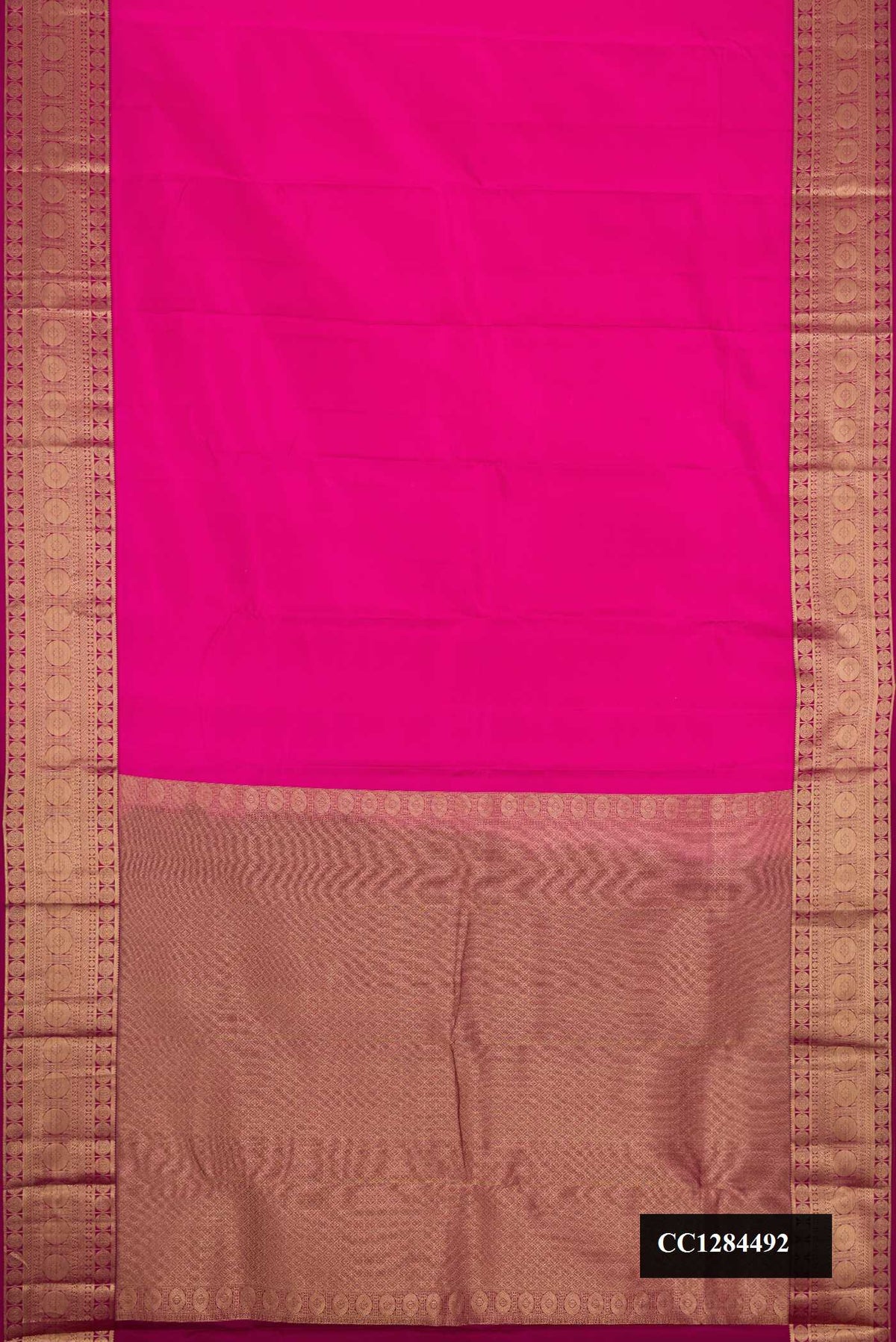 Pink Dual Tone Kanchipuram Silk Saree with Plain Body and Zari Border.  displayed on a mannequin