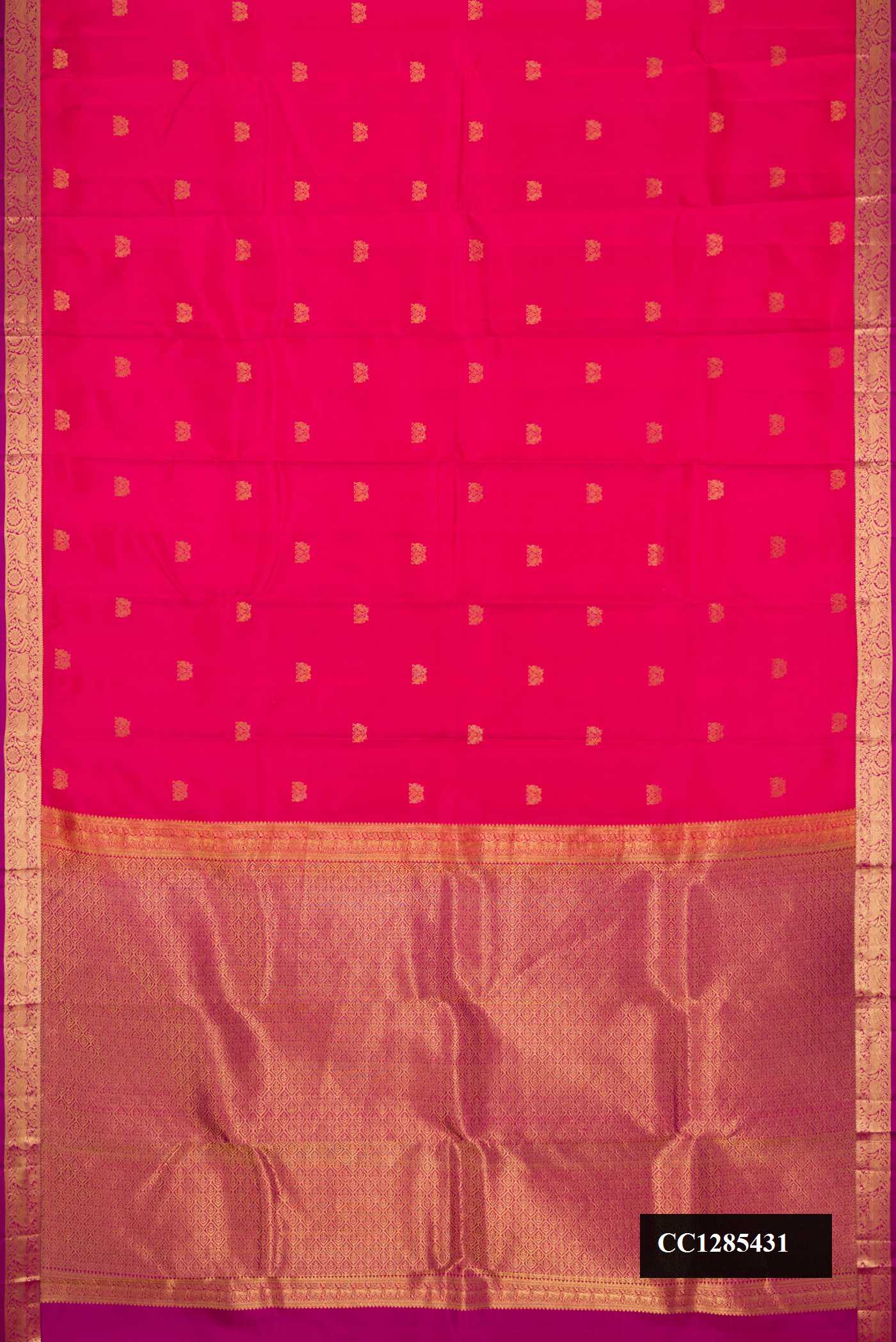 Orange Dual Tone Kanchipuram Silk Saree with Zari Butta on the body and Zari Border.  displayed on a mannequin