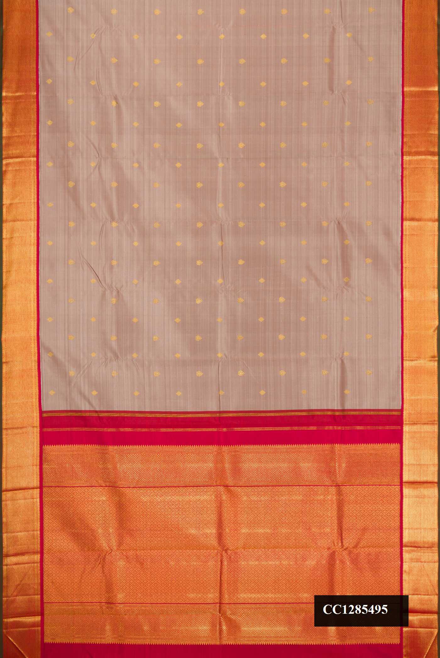 Grey Dual Tone Kanchipuram Silk Saree with Zari Butta on the body and Zari Border.  displayed on a mannequin