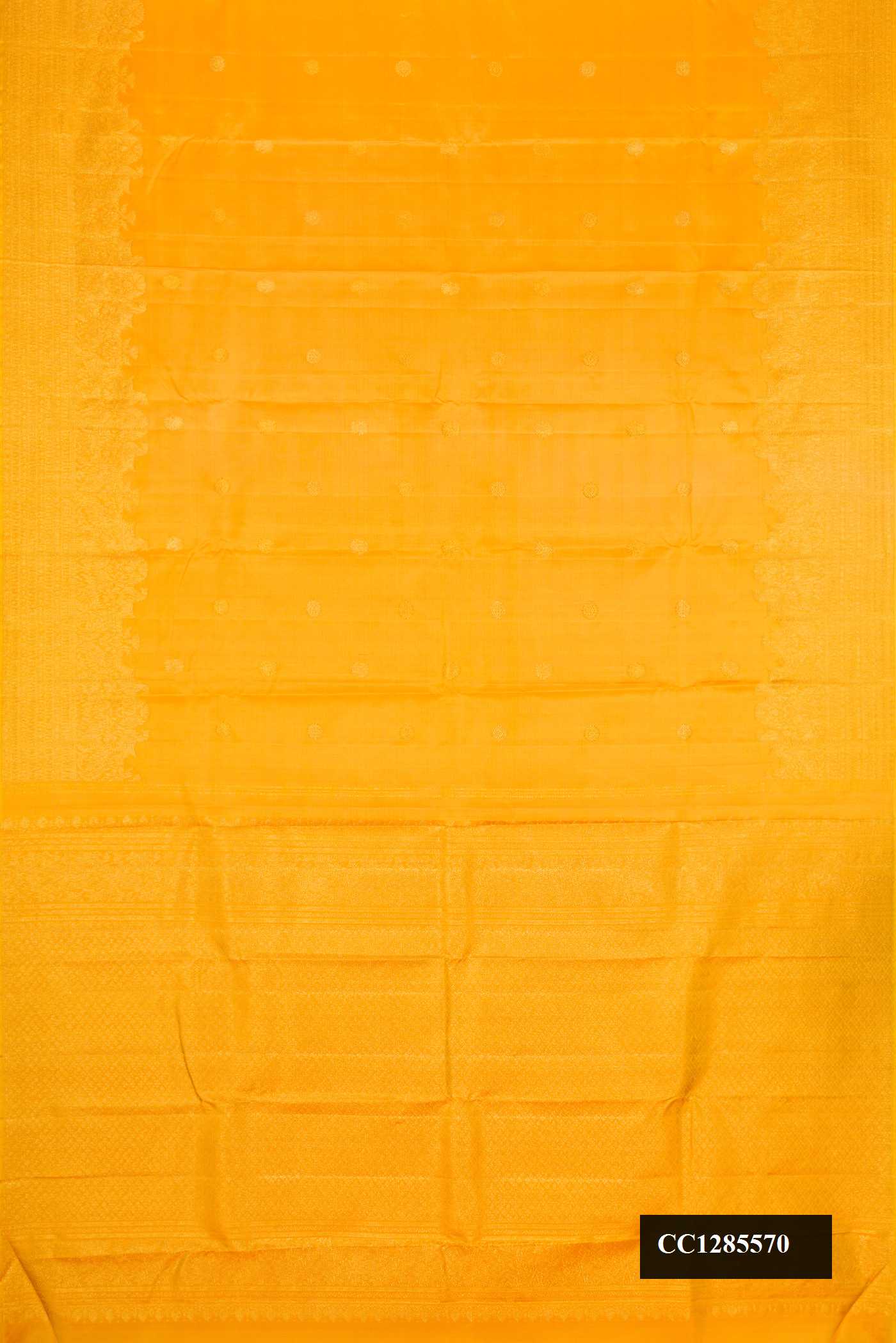 Yellow Dual Tone Kanchipuram Silk Saree with Zari Butta on the body and Zari Border.  displayed on a mannequin