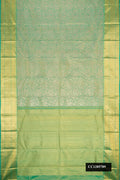 Green Dual Tone Kanchipuram Silk Saree with Zari Brocade on the body and Zari Border.  displayed on a mannequin