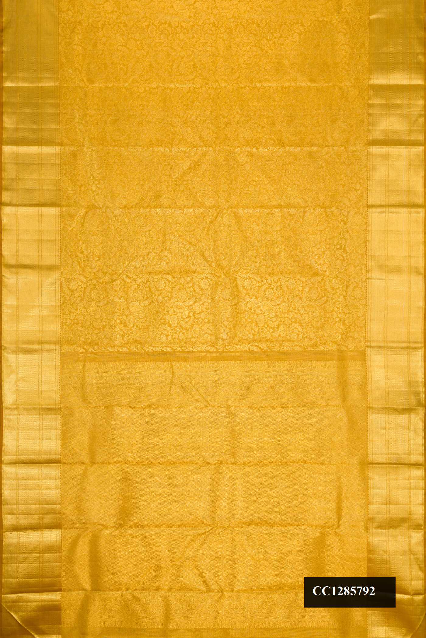 Gold Dual Tone Kanchipuram Silk Saree with Zari Brocade on the body and Zari Border.  displayed on a mannequin