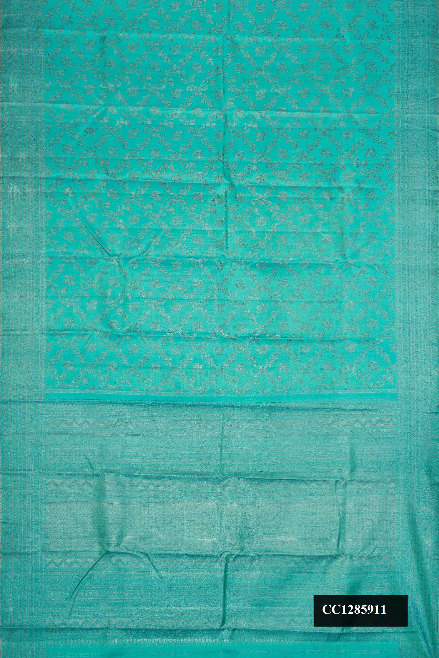 Sea Green Dual Tone Kanchipuram Silk Saree with Zari Brocade on the body and Zari Border.  displayed on a mannequin