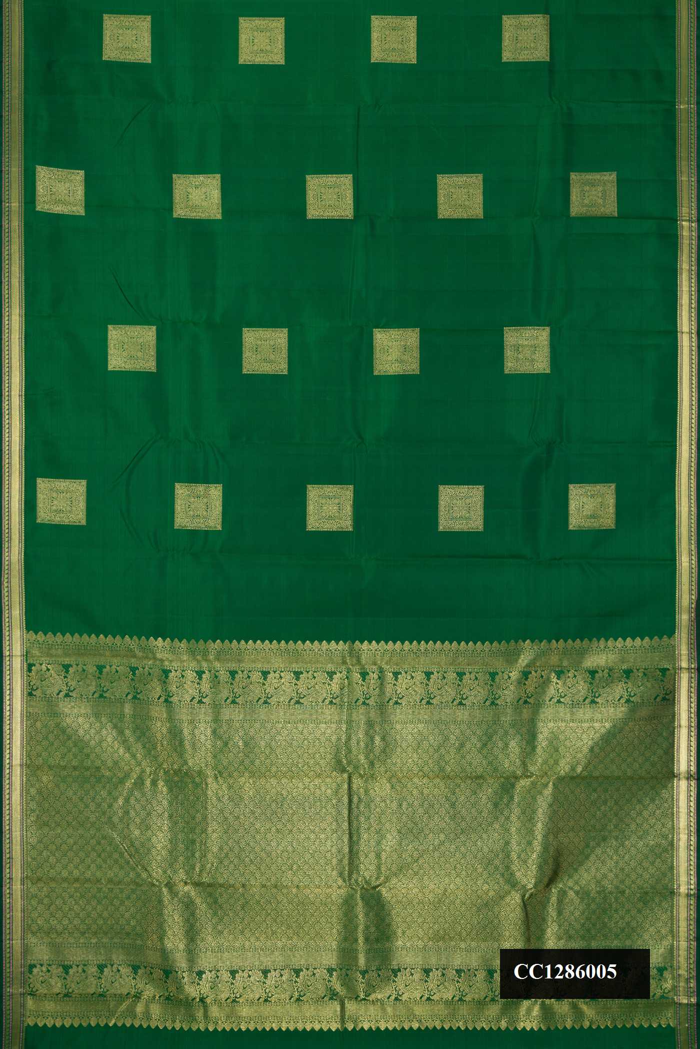 Bottle Green Dual Tone Kanchipuram Silk Saree with Zari Butta on the body and Zari Border.  displayed on a mannequin
