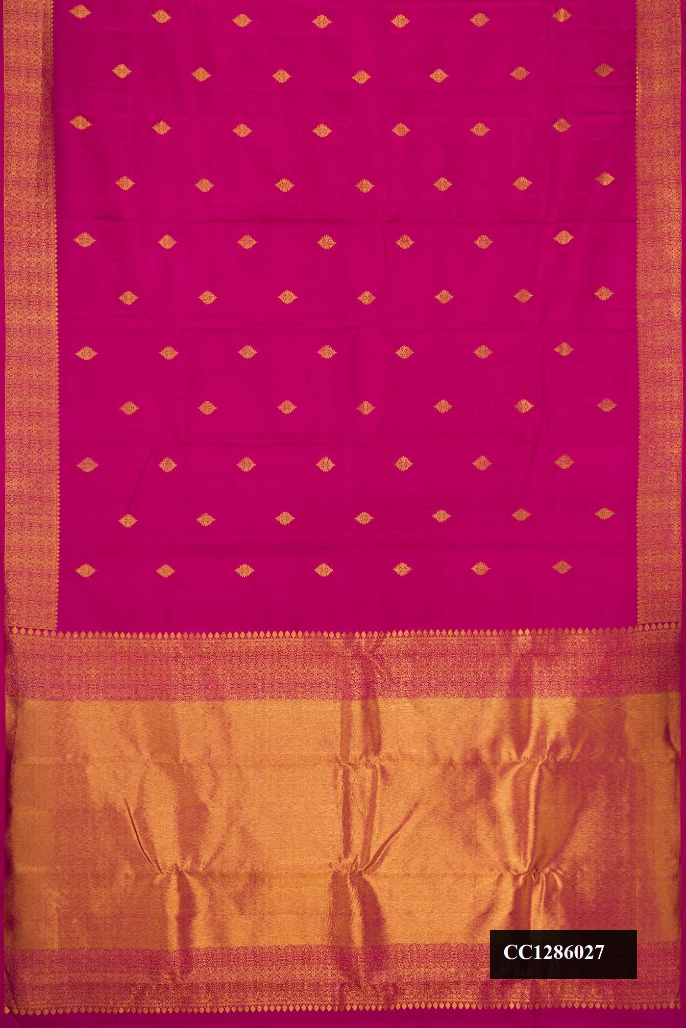 Magenta Dual Tone Kanchipuram Silk Saree with Zari Butta on the body and Zari Border.  displayed on a mannequin