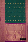 Bottle Green Dual Tone Kanchipuram Silk Saree with Zari Butta on the body and Zari Border.  displayed on a mannequin