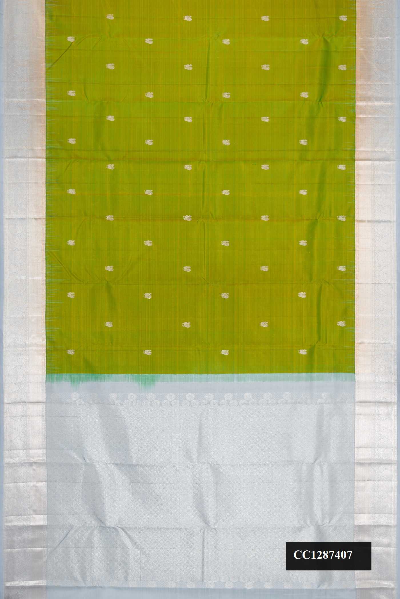 Green Dual Tone Kanchipuram Silk Saree with Zari Butta on the body and Zari Border.  displayed on a mannequin