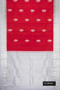 Brick Orange Dual Tone Kanchipuram Silk Saree with Zari Butta on the body and Zari Border.  displayed on a mannequin