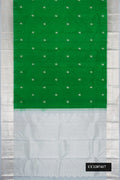 Green Dual Tone Kanchipuram Silk Saree with Zari Butta on the body and Zari Border.  displayed on a mannequin
