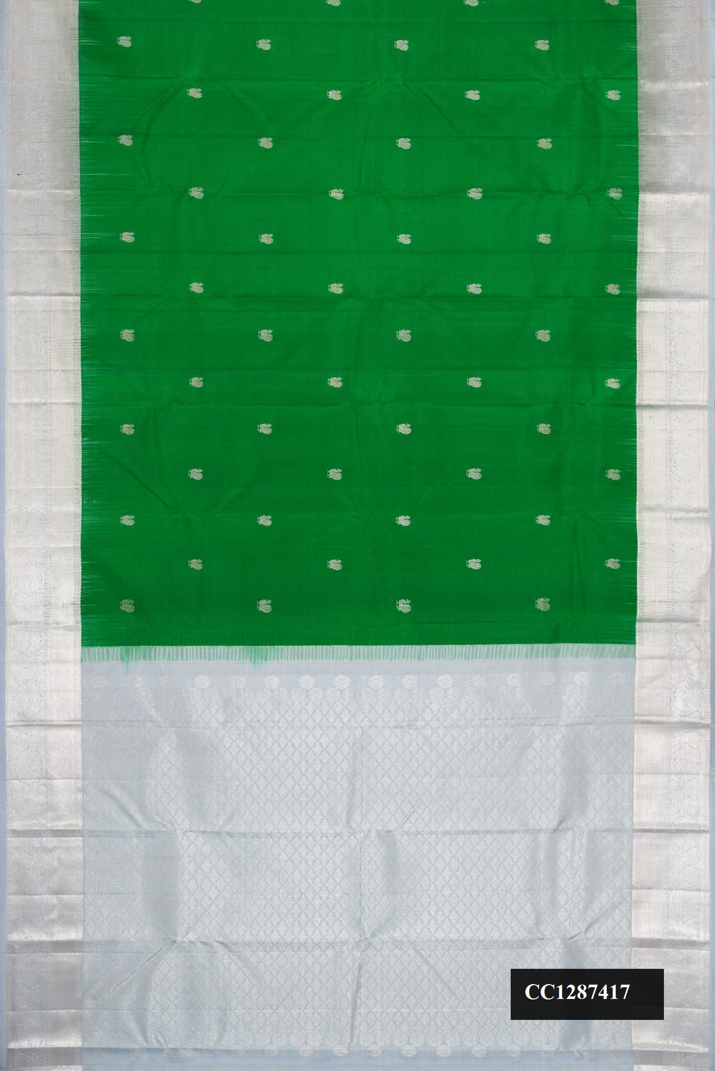 Green Dual Tone Kanchipuram Silk Saree with Zari Butta on the body and Zari Border.  displayed on a mannequin