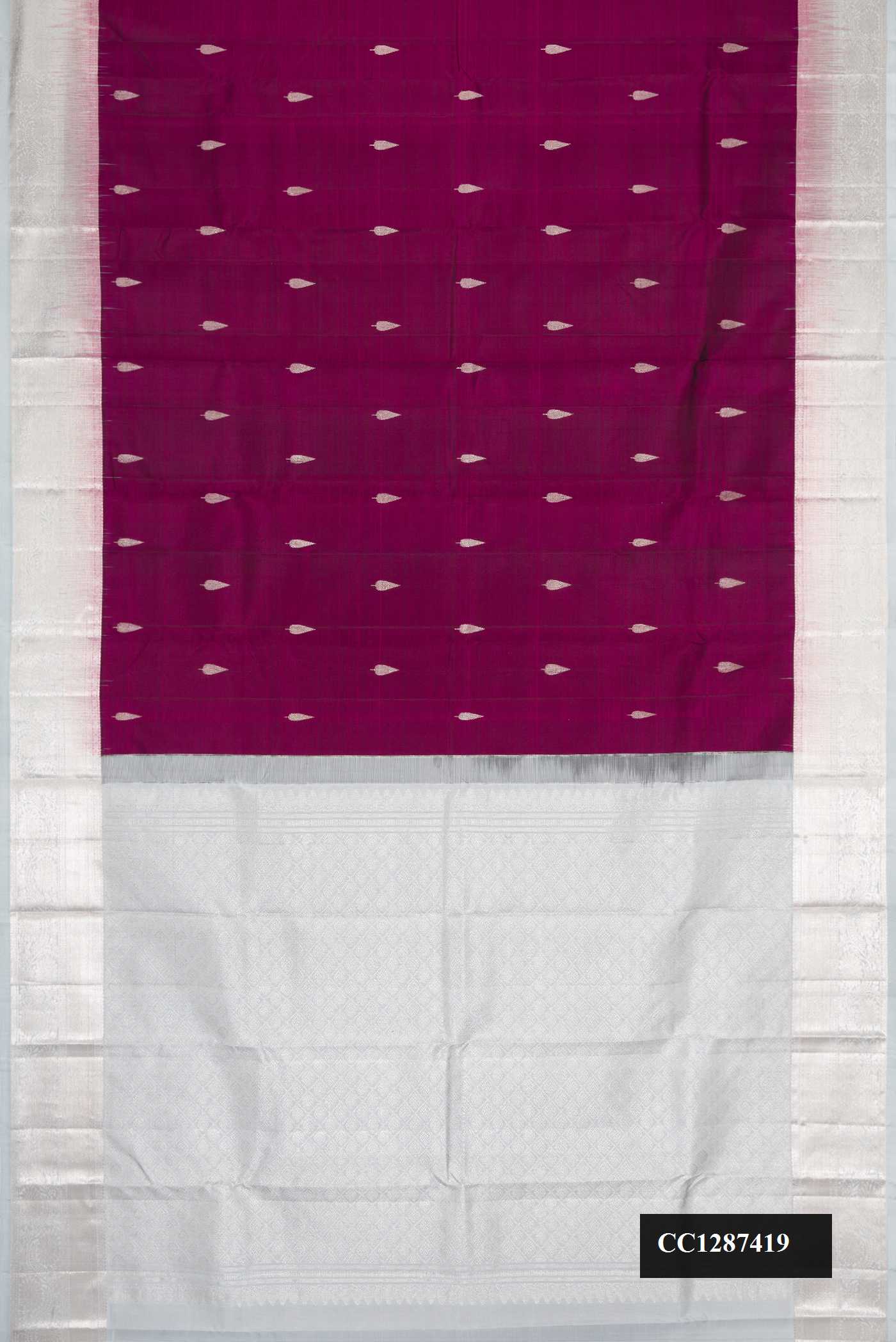 Burgundy Dual Tone Kanchipuram Silk Saree with Zari Butta on the body and Zari Border.  displayed on a mannequin