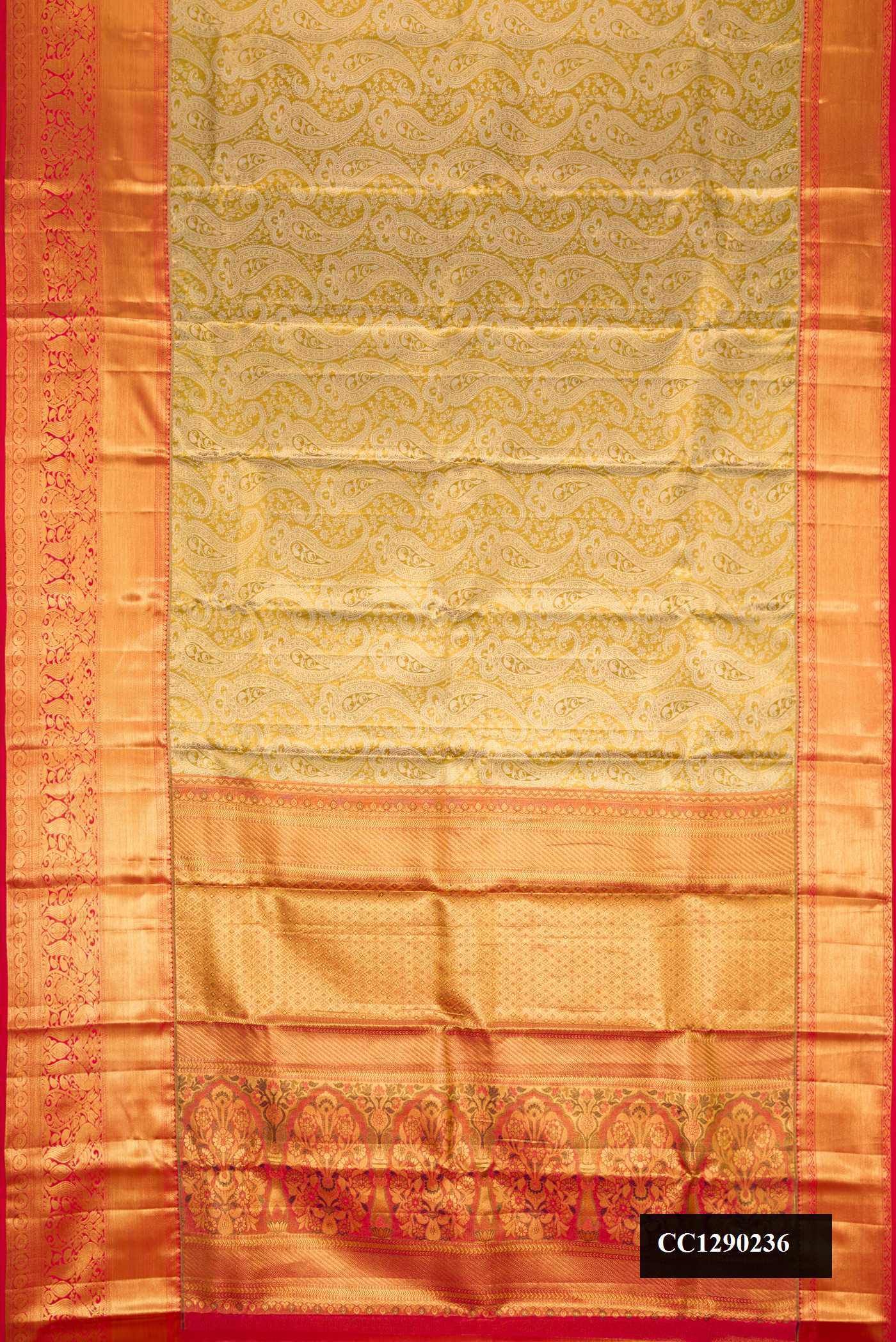 Golden Dual Tone Kanchipuram Silk Saree with Zari Brocade on the body and Zari Border.  displayed on a mannequin