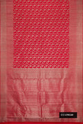 Red Dual Tone Kanchipuram Silk Saree with Zari Butta on the body and Zari Border.  displayed on a mannequin