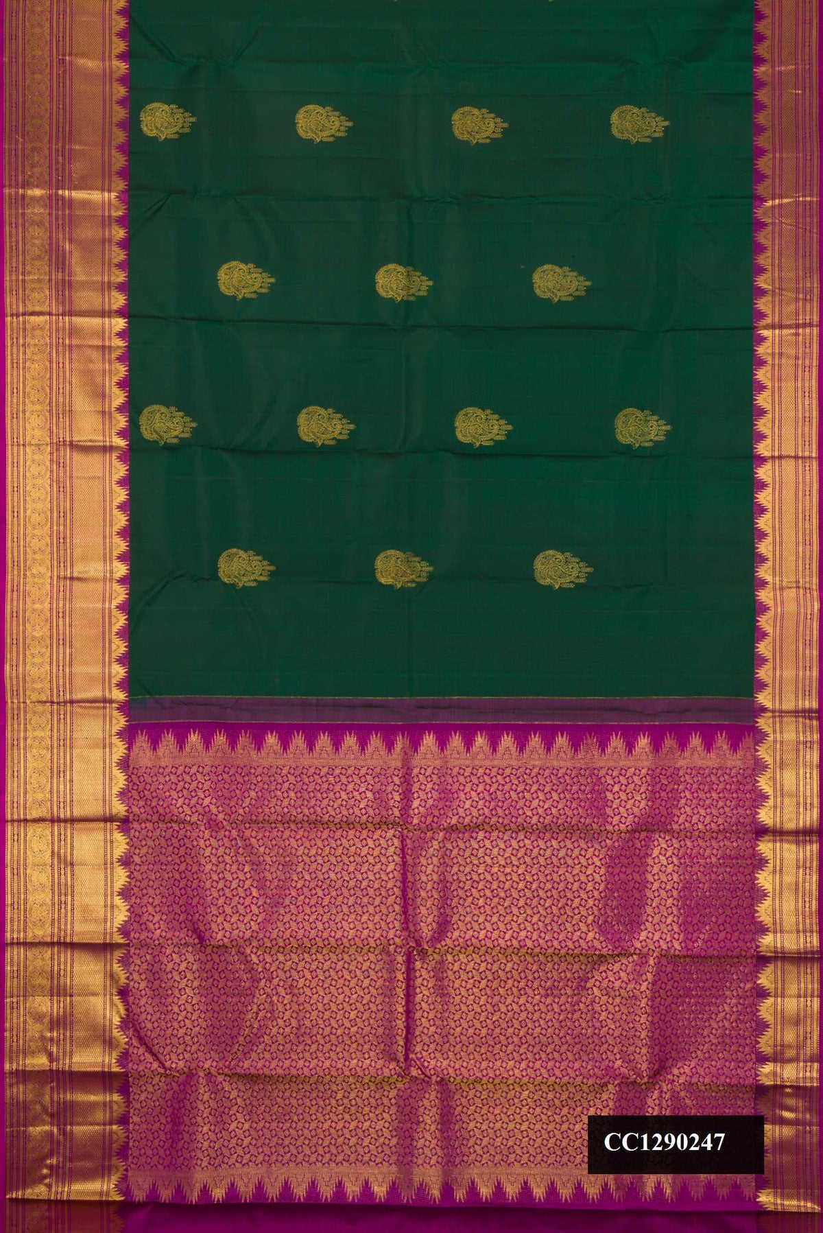 Green Dual Tone Kanchipuram Silk Saree with Zari Butta on the body and Zari Border.  displayed on a mannequin
