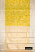 Parrot Green Dual Tone Kanchipuram Tissue Silk Saree with Zari Brocade on the body and Zari Border.  displayed on a mannequin