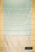 Sky Blue Dual Tone Kanchipuram Tissue Silk Saree with Zari Brocade on the body and Zari Border.  displayed on a mannequin