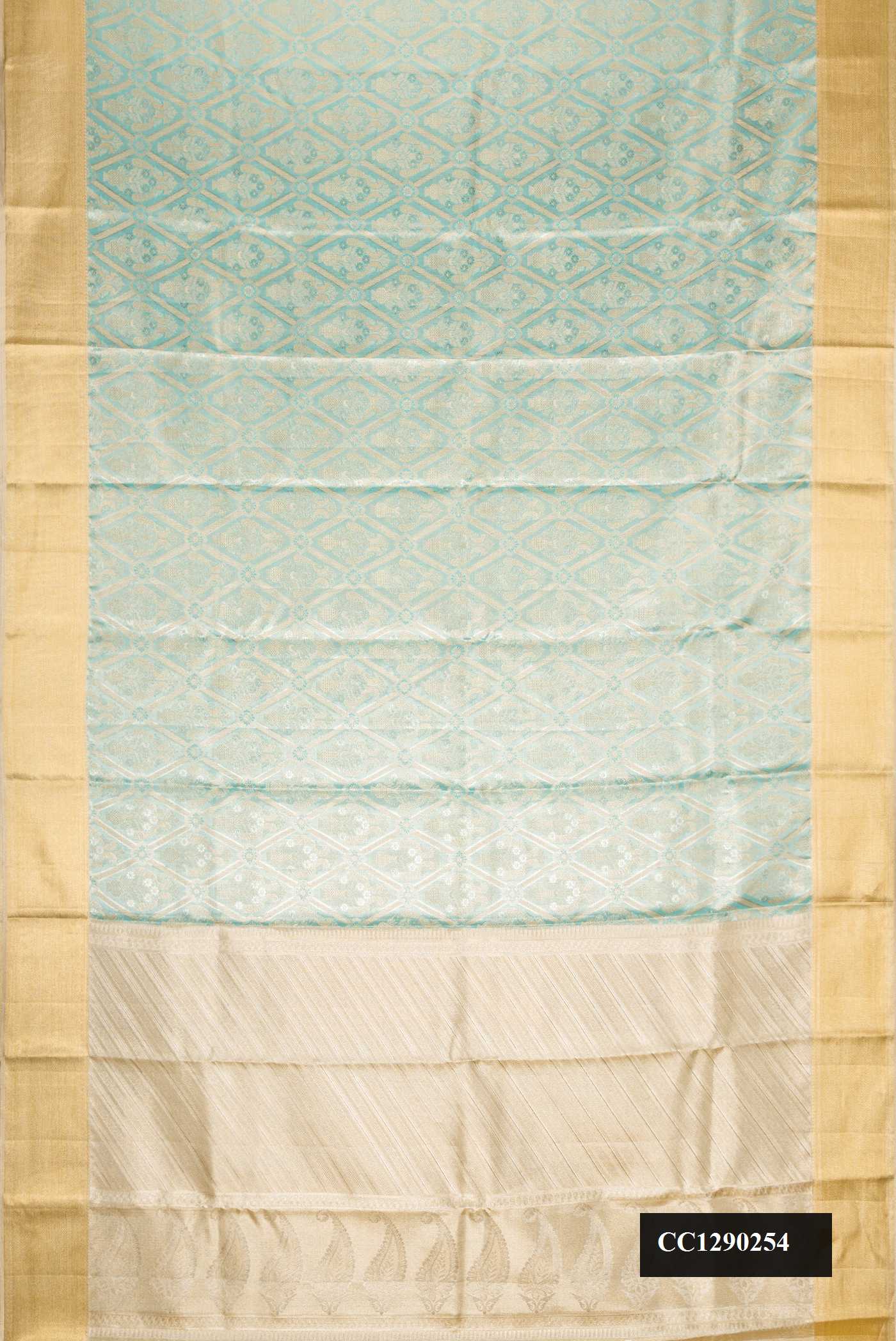 Sky Blue Dual Tone Kanchipuram Tissue Silk Saree with Zari Brocade on the body and Zari Border.  displayed on a mannequin