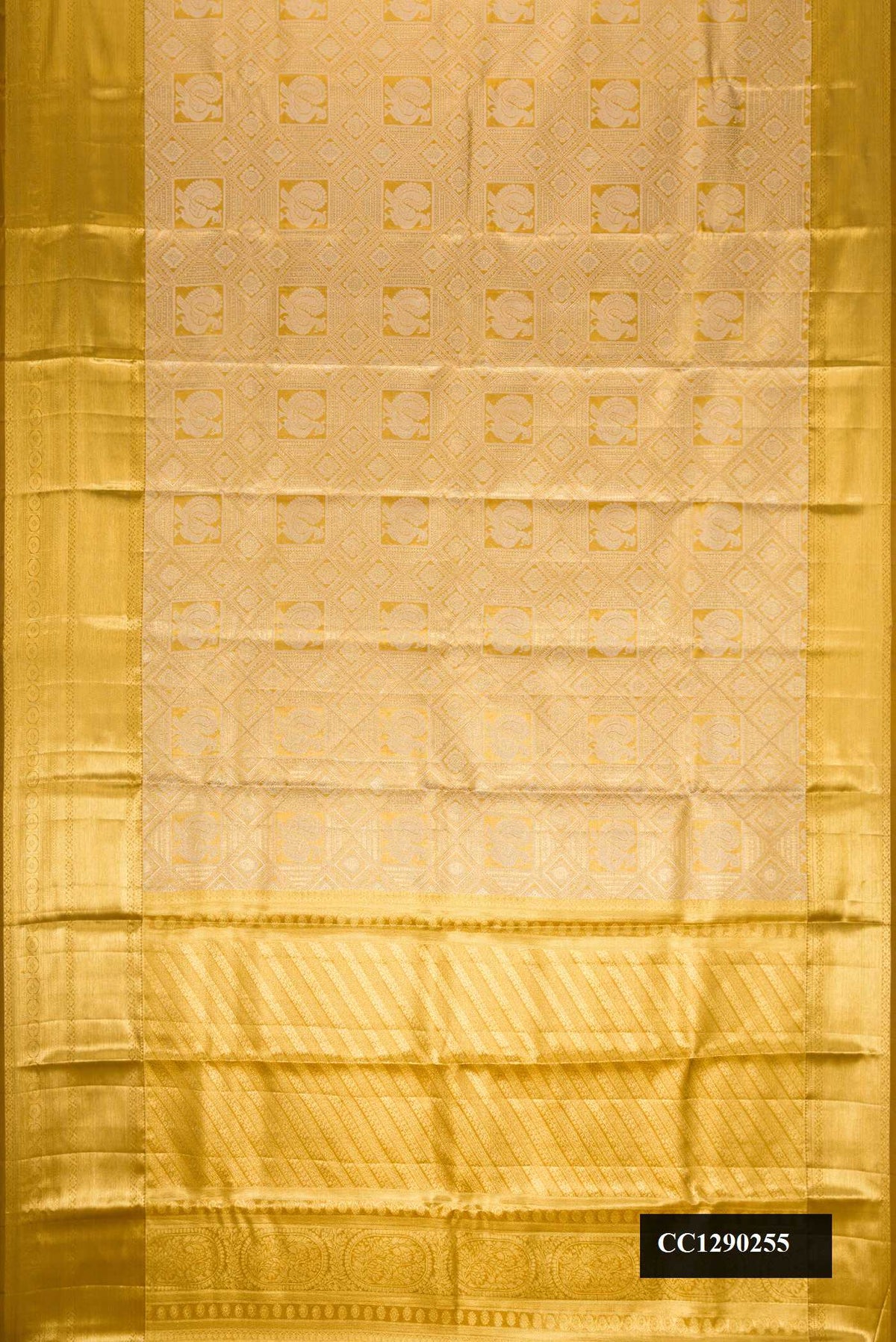 Gold Dual Tone Kanchipuram Tissue Silk Saree with Zari Brocade on the body and Zari Border.  displayed on a mannequin