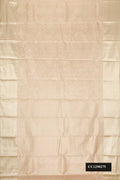 Beige Dual Tone Kanchipuram Tissue Silk Saree with Zari Brocade on the body and Zari Border.  displayed on a mannequin