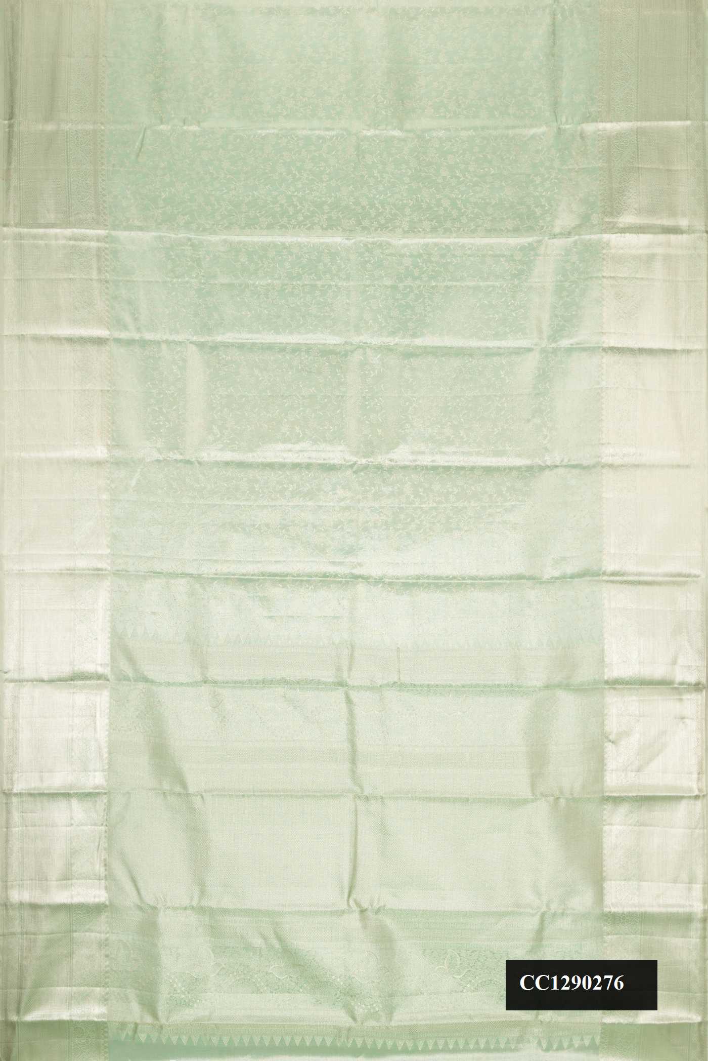 Green Dual Tone Kanchipuram Tissue Silk Saree with Zari Brocade on the body and Zari Border.  displayed on a mannequin