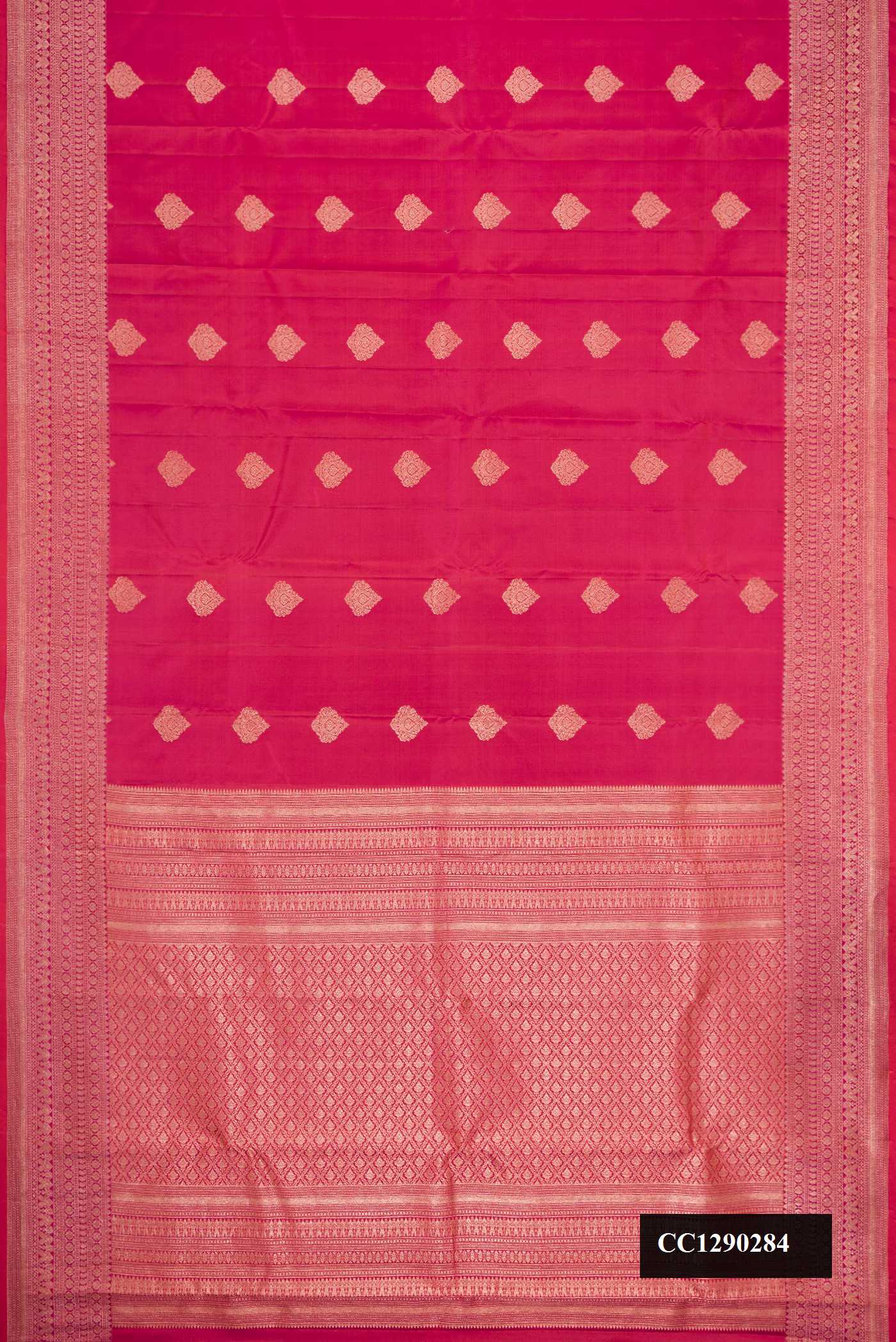 Dark Pink Dual Tone Kanchipuram Silk Saree with Zari Butta on the body and Zari Border.  displayed on a mannequin