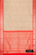 Beige Dual Tone Kanchipuram Silk Saree with Zari Butta on the body and Zari Border.  displayed on a mannequin