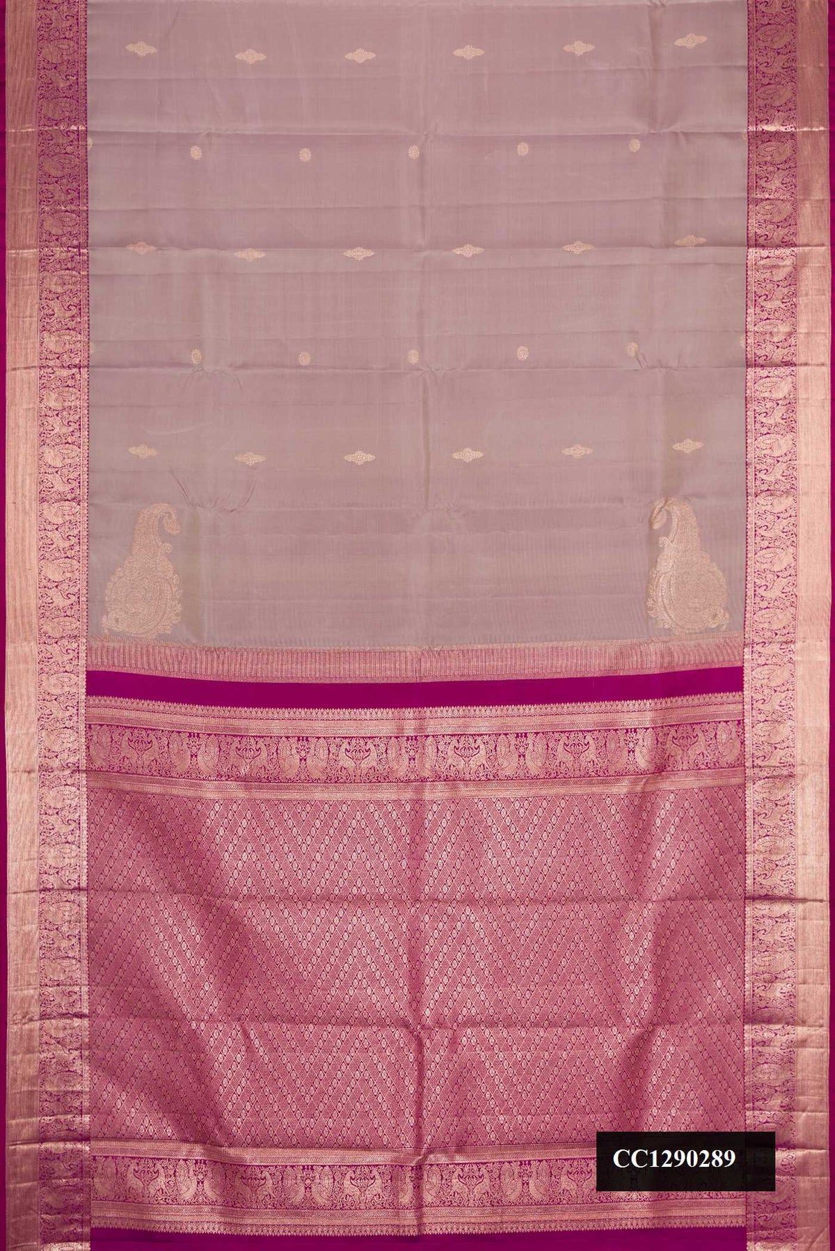 Grey Dual Tone Kanchipuram Silk Saree with Zari Butta on the body and Zari Border.  displayed on a mannequin