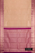 Brown Dual Tone Kanchipuram Silk Saree with Zari Butta on the body and Zari Border.  displayed on a mannequin