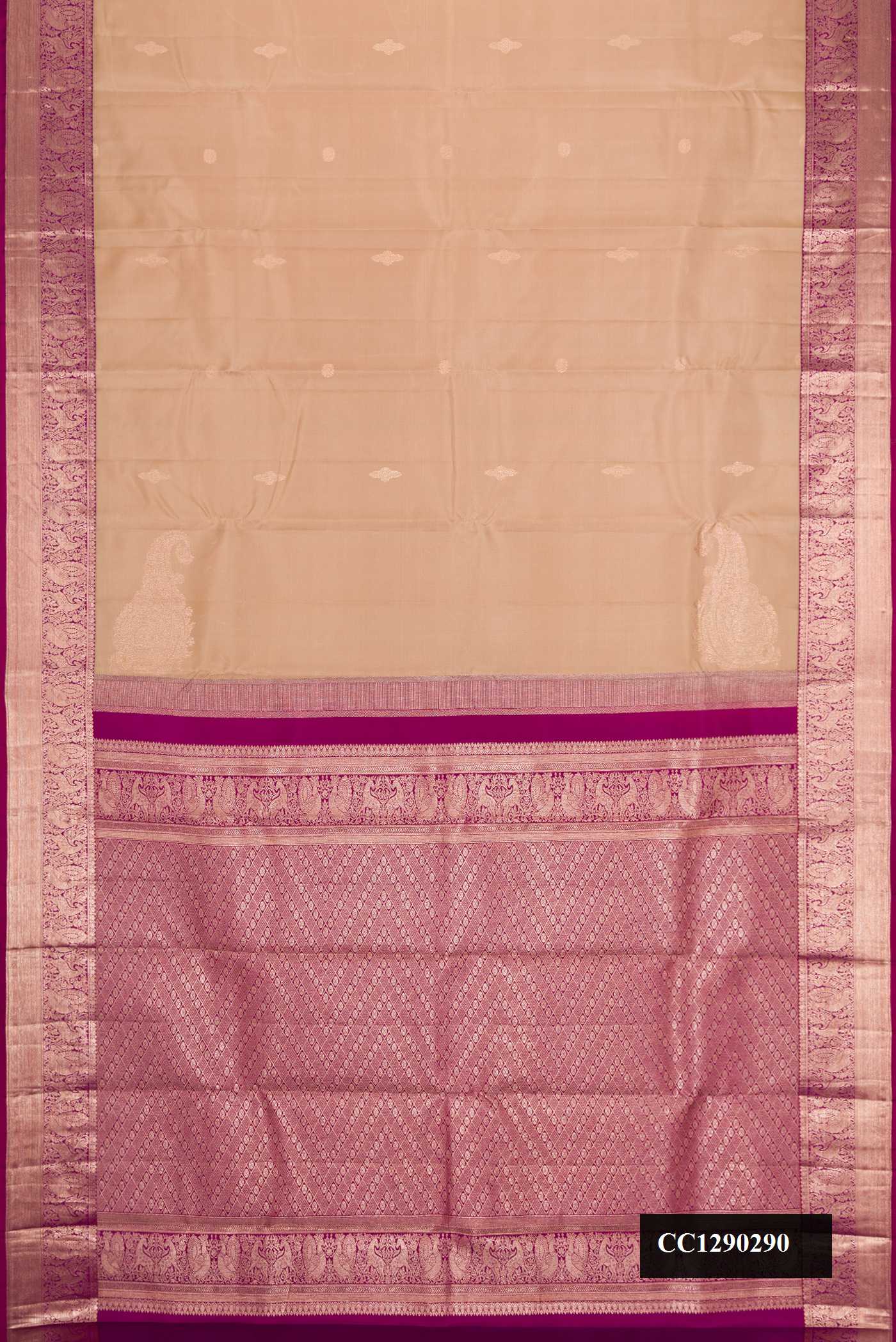 Brown Dual Tone Kanchipuram Silk Saree with Zari Butta on the body and Zari Border.  displayed on a mannequin