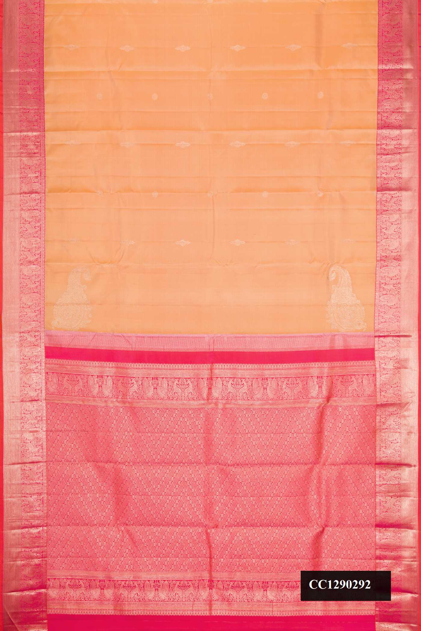 Golden Peach Dual Tone Kanchipuram Silk Saree with Zari Butta on the body and Zari Border.  displayed on a mannequin