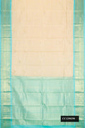 Sandal Dual Tone Kanchipuram Silk Saree with Zari Butta on the body and Zari Border.  displayed on a mannequin