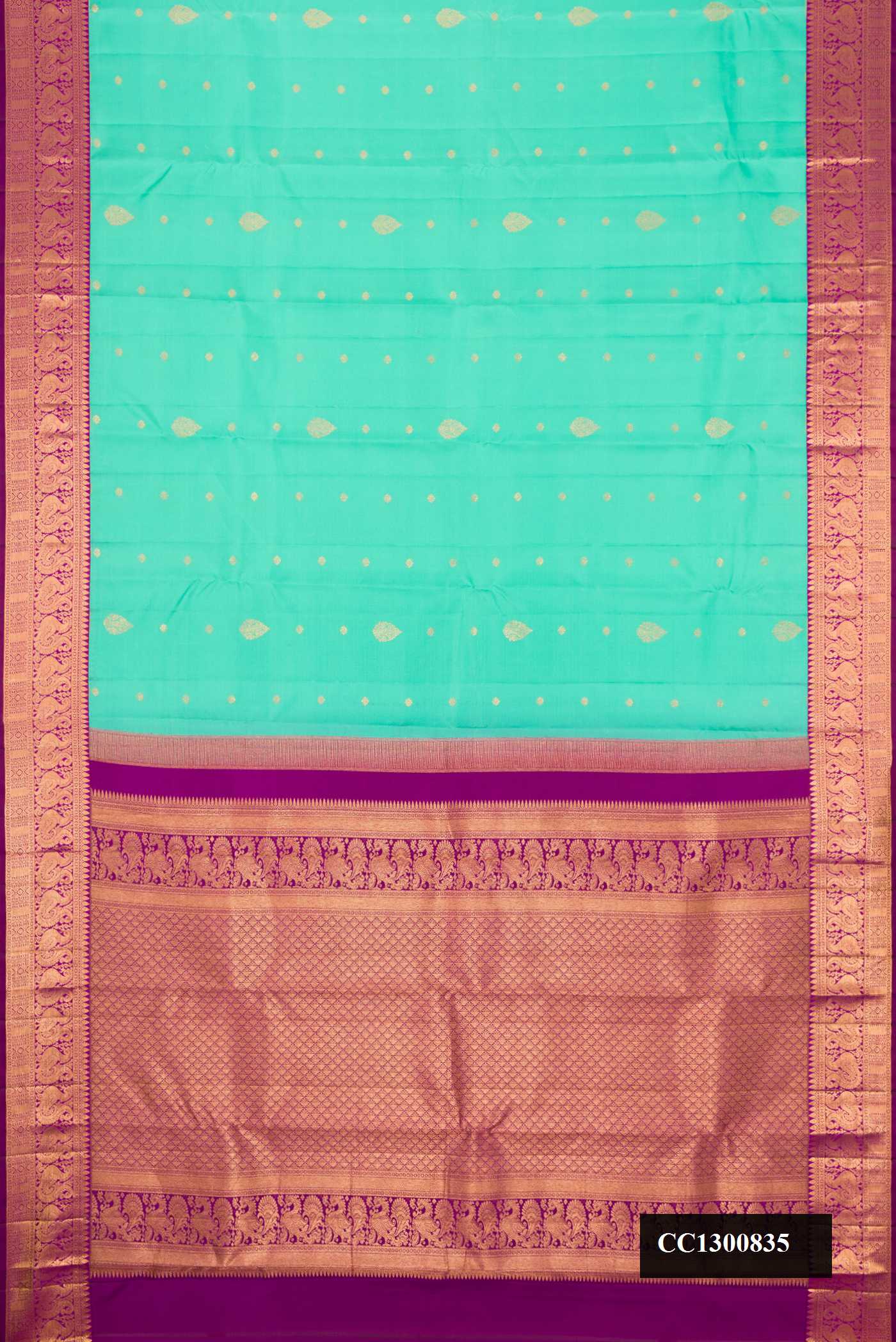 Sea Green Dual Tone Kanchipuram Silk Saree with Zari Butta on the body and Zari Border.  displayed on a mannequin