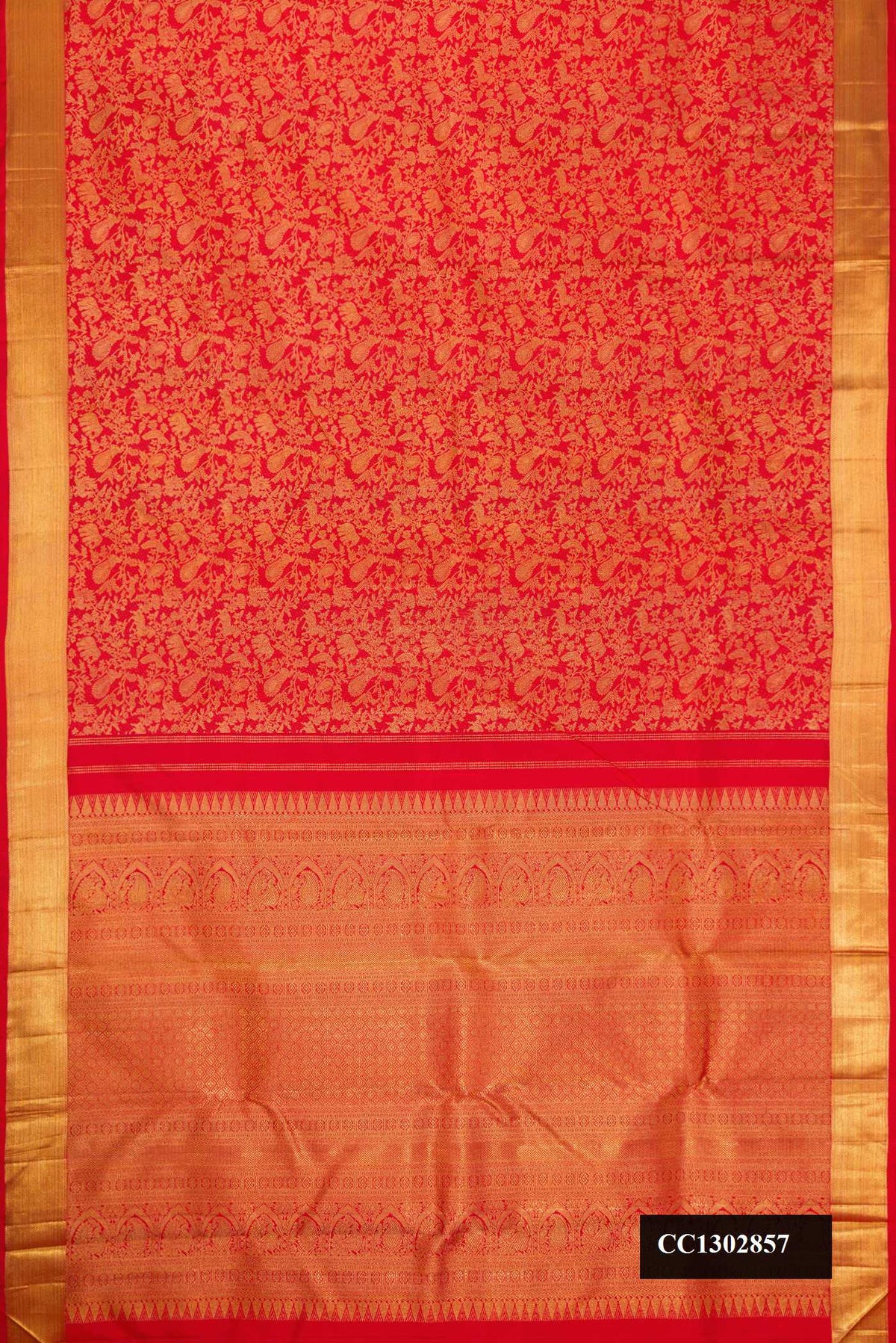 Red Dual Tone Kanchipuram Silk Saree with Zari Brocade on the body and Zari Border.  displayed on a mannequin