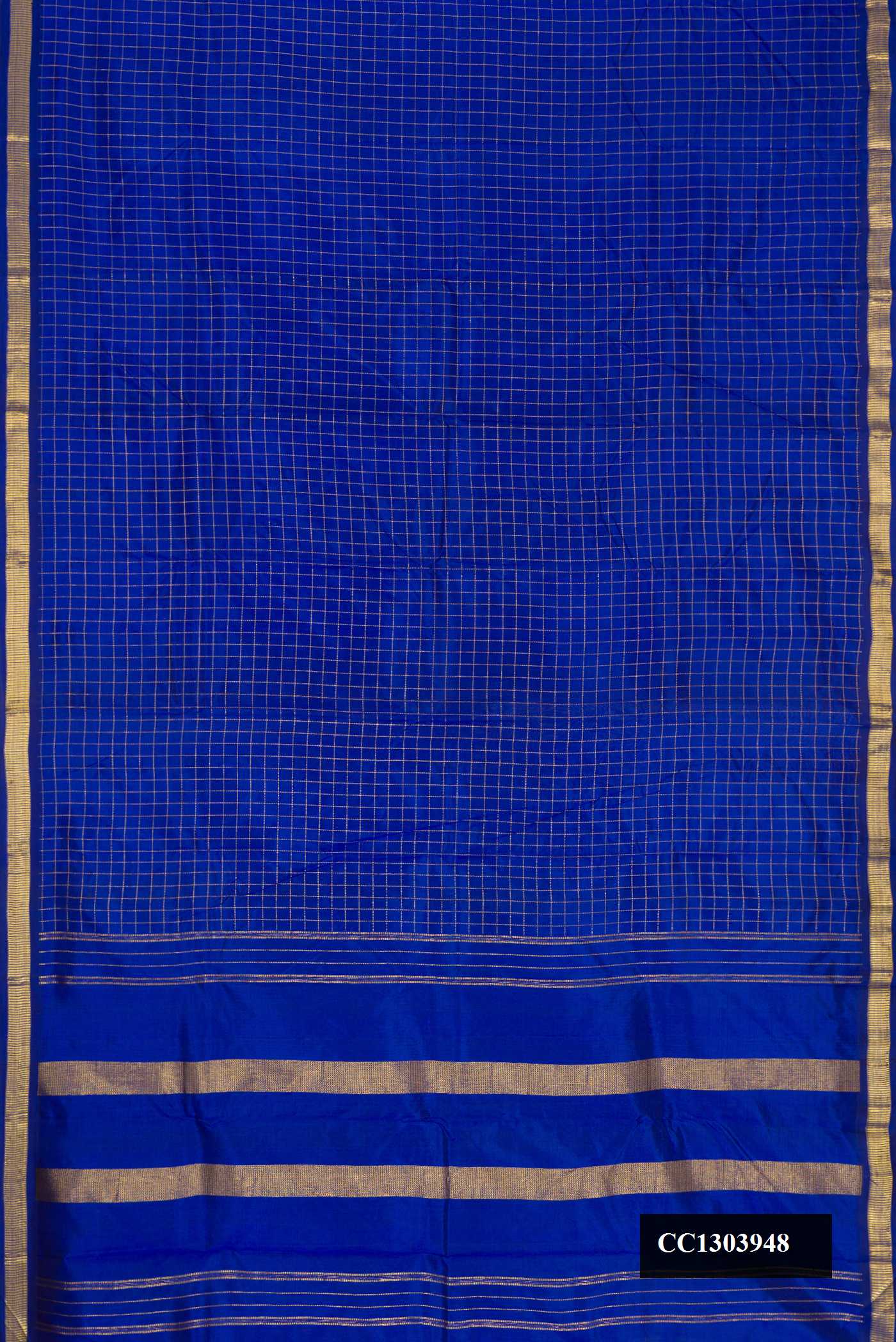 Royal Blue Dual Tone Kanchipuram Silk Saree with Checked design on the body and Zari Border.  displayed on a mannequin