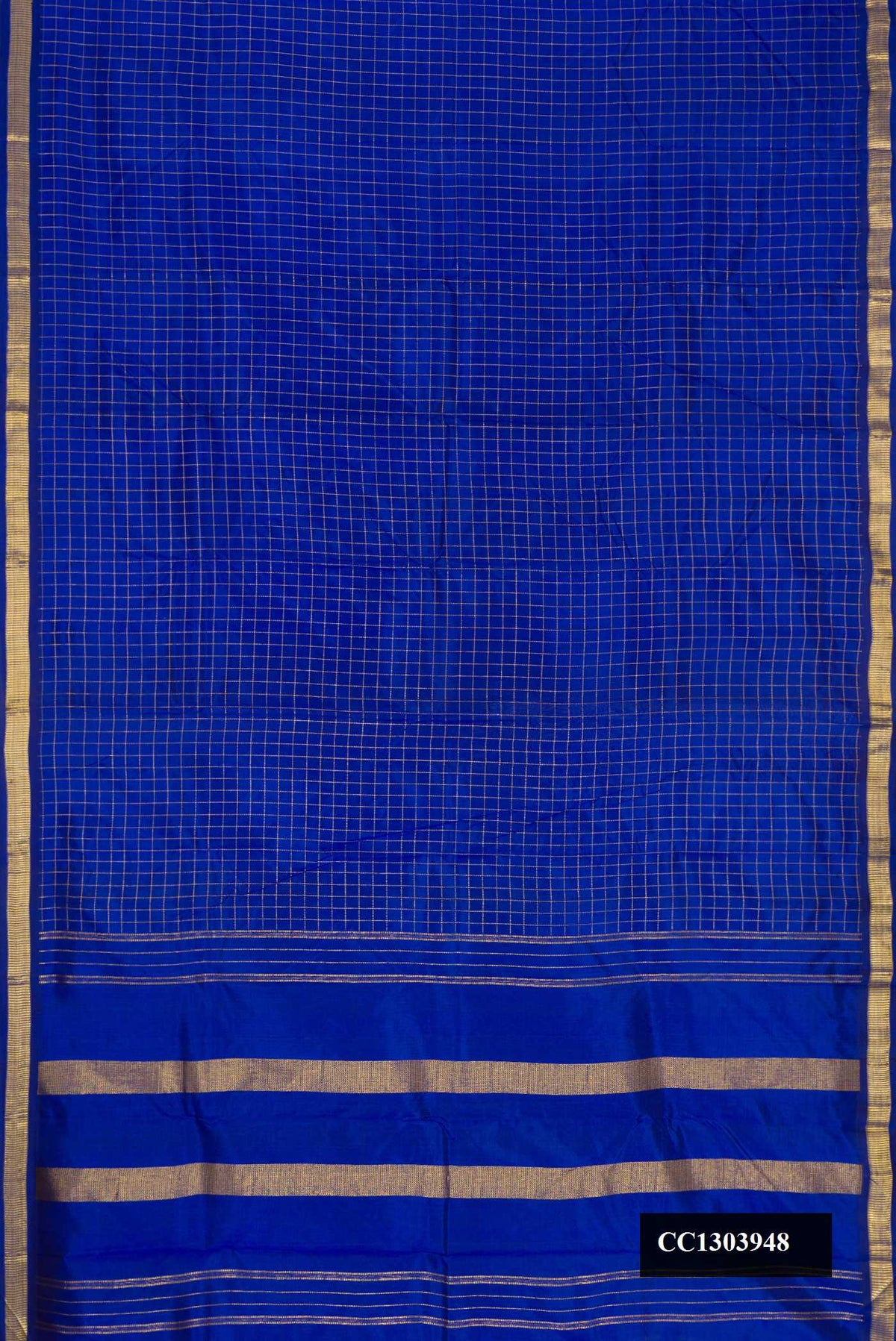 Royal Blue Dual Tone Kanchipuram Silk Saree with Checked design on the body and Zari Border.  displayed on a mannequin