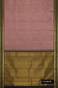 Brown Dual Tone Kanchipuram Silk Saree with Zari Butta on the body and Zari Border.  displayed on a mannequin
