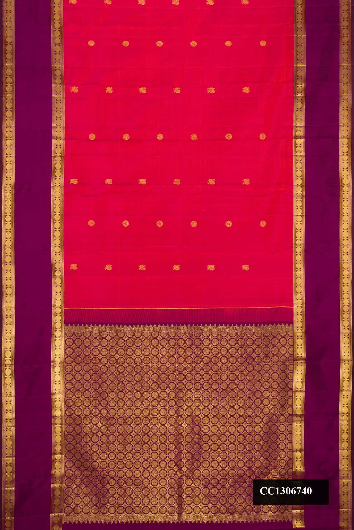 Coral Dual Tone Kanchipuram Silk Saree with Zari Butta on the body and Zari Border.  displayed on a mannequin