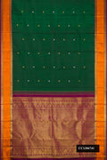 Bottle Green Dual Tone Kanchipuram Silk Saree with Zari Butta on the body and Zari And Thread Border.  displayed on a mannequin