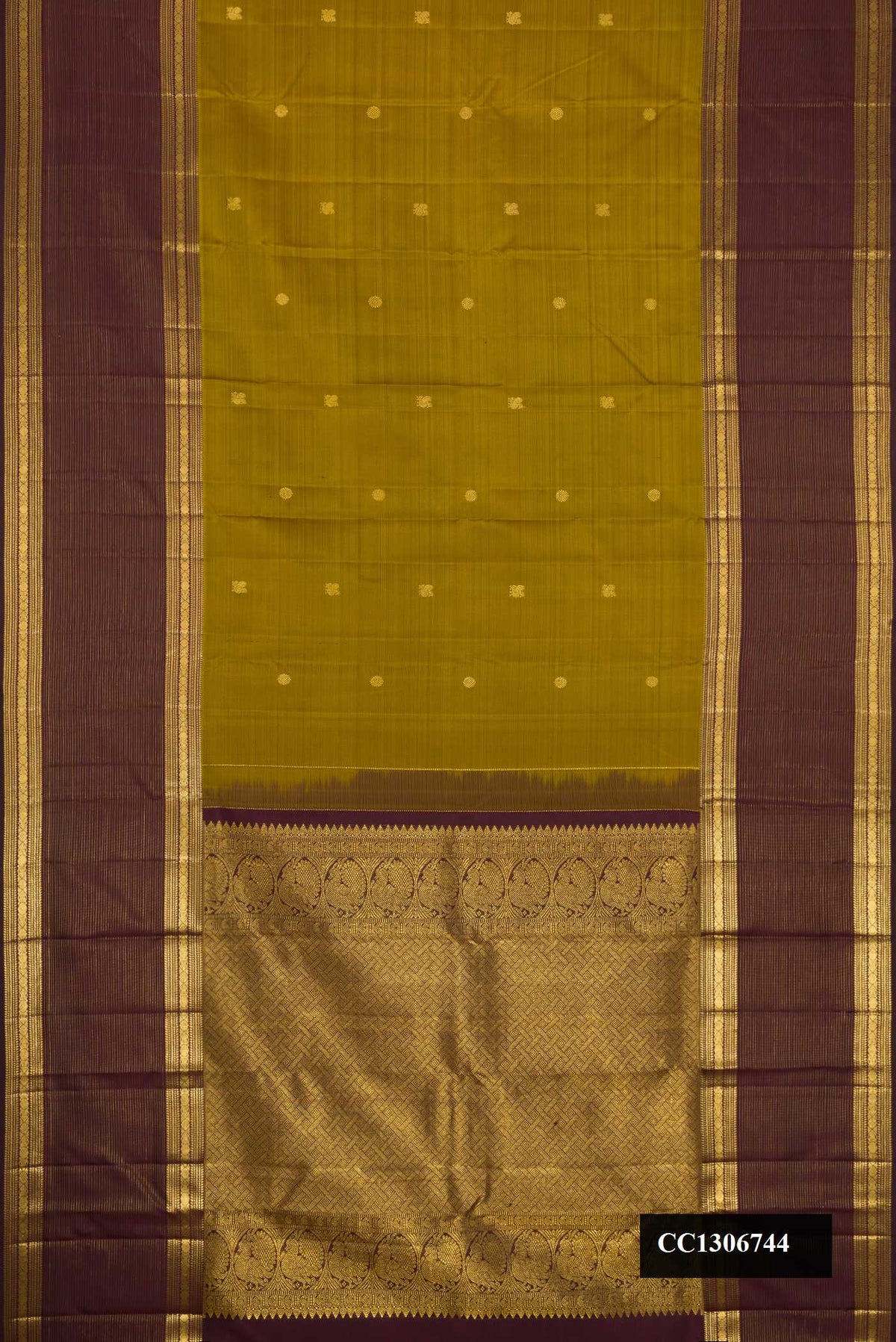 Mehandi Green Dual Tone Kanchipuram Silk Saree with Zari Butta on the body and Zari Border.  displayed on a mannequin