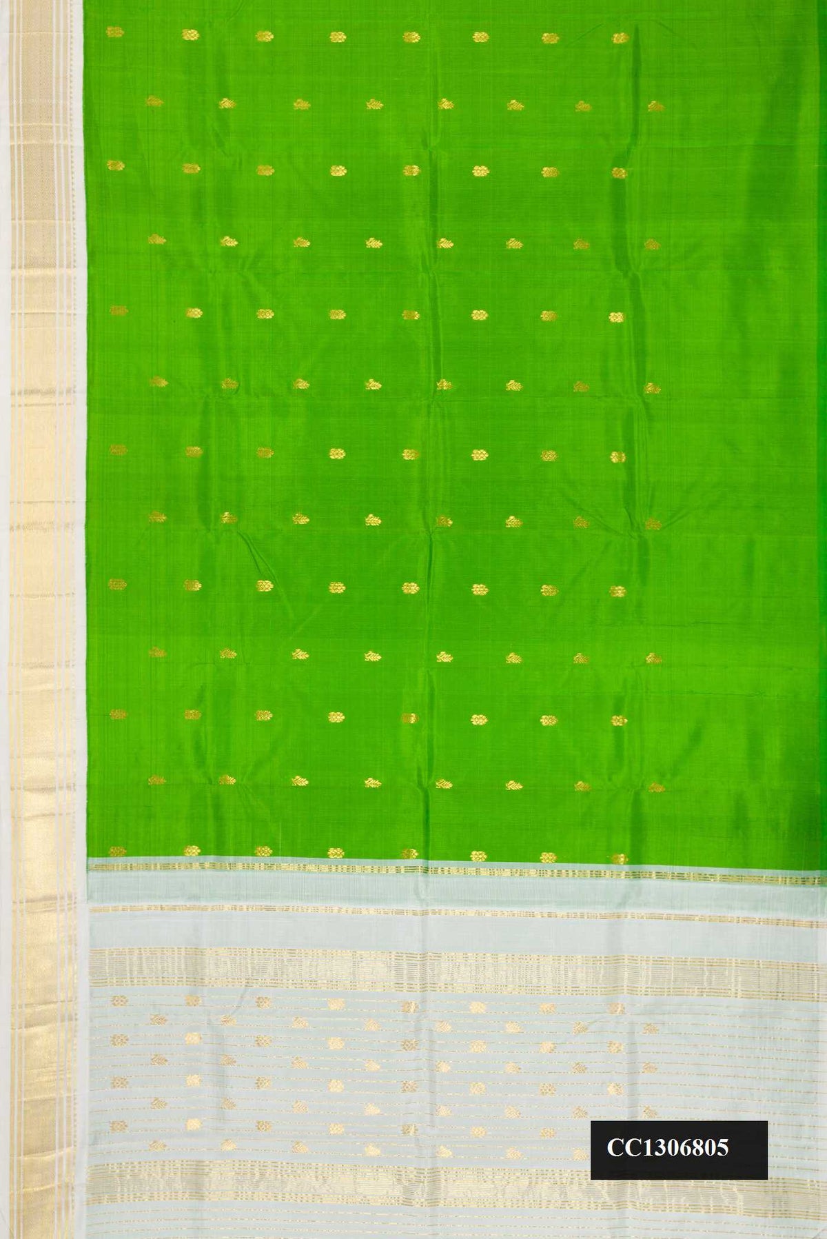Parrot Green Dual Tone Kanchipuram Silk Saree with Zari Butta on the body and One Side Border.  displayed on a mannequin