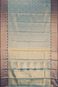 Peacock Blue Dual Tone Kanchipuram Tissue Silk Saree with Zari Brocade on the body and Fancy Border.  displayed on a mannequin