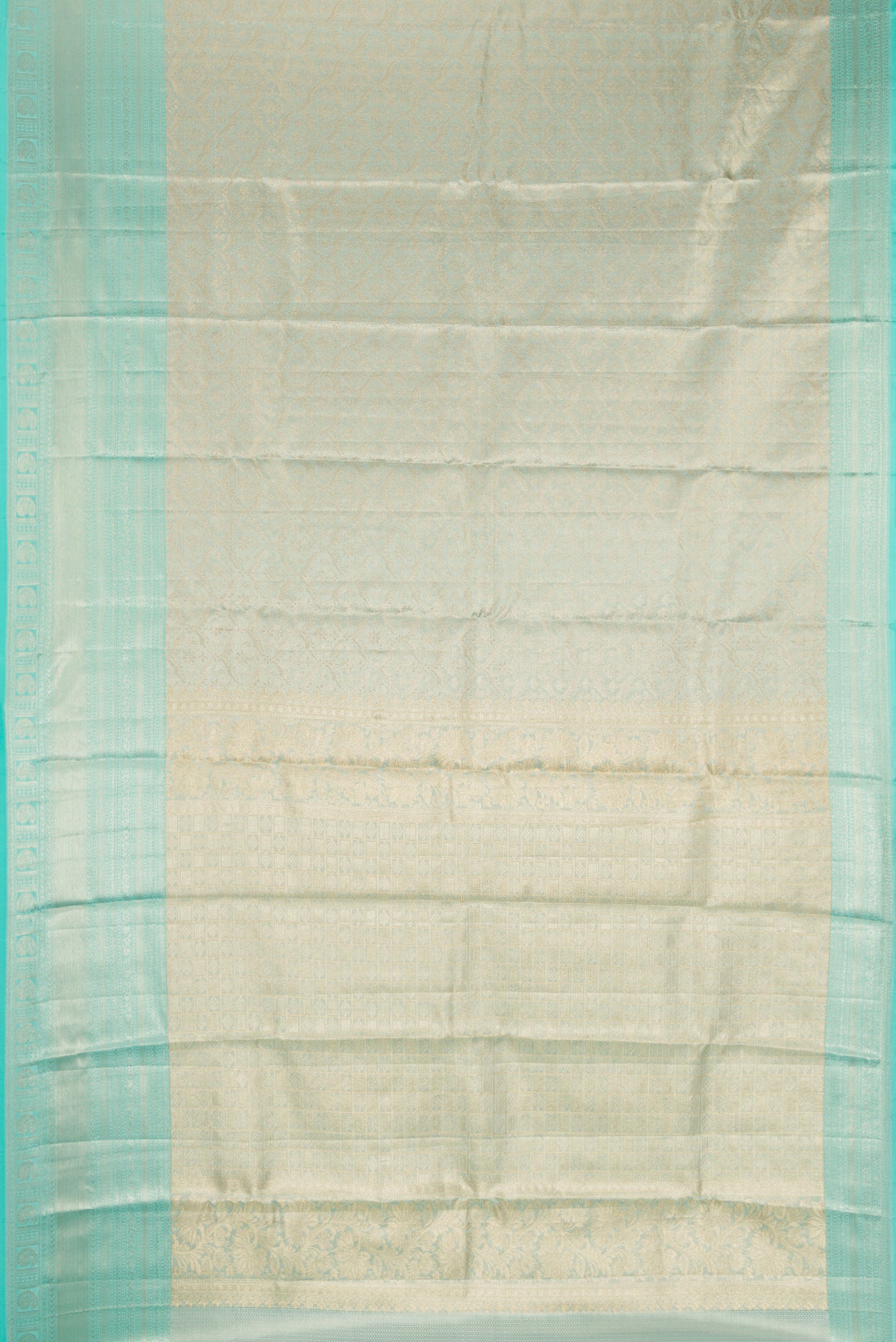 Sky Blue Dual Tone Kanchipuram Tissue Silk Saree with Zari Brocade on the body and Fancy Border.  displayed on a mannequin