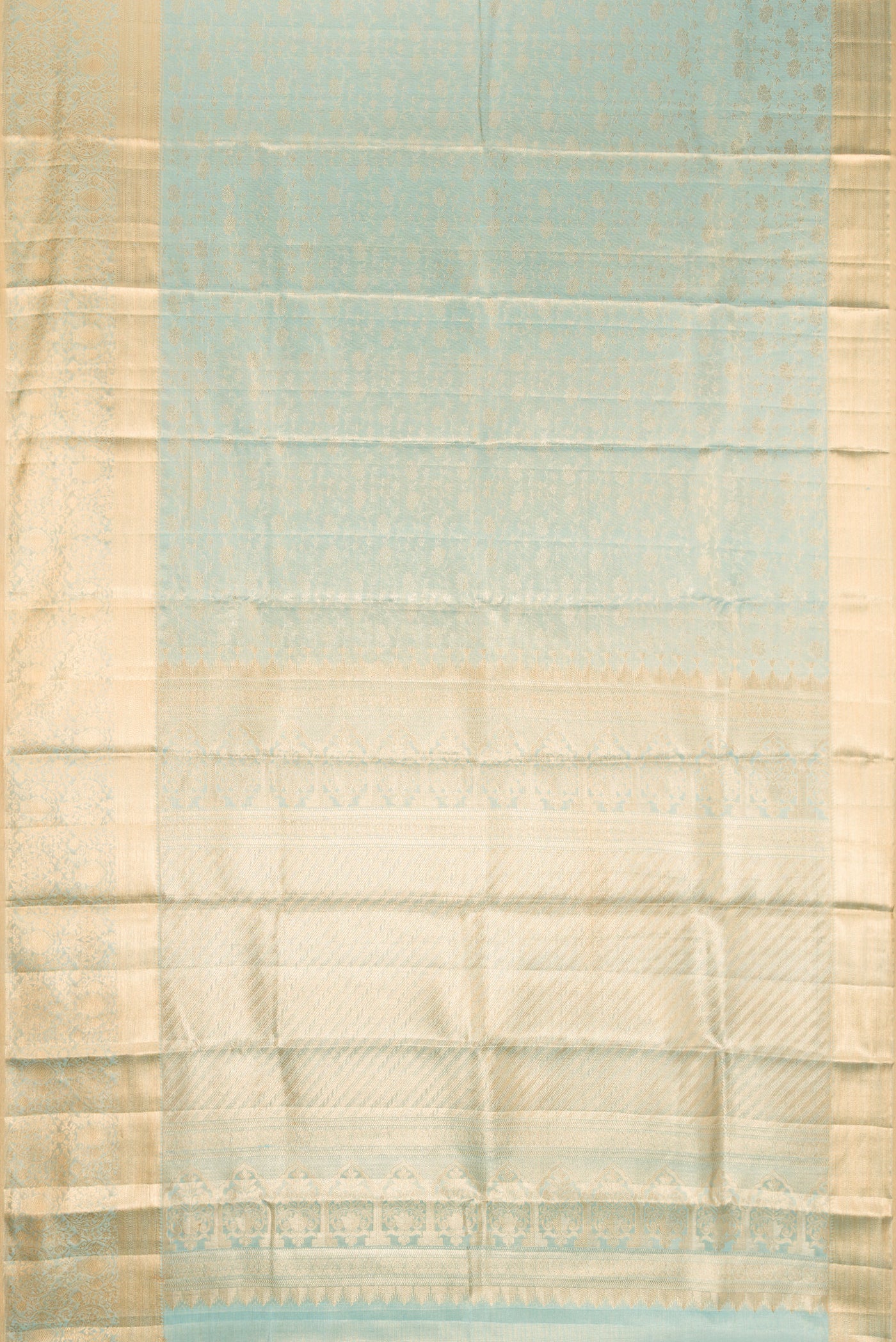 Sky Blue Dual Tone Kanchipuram Tissue Silk Saree with Zari Brocade on the body and Fancy Border.  displayed on a mannequin