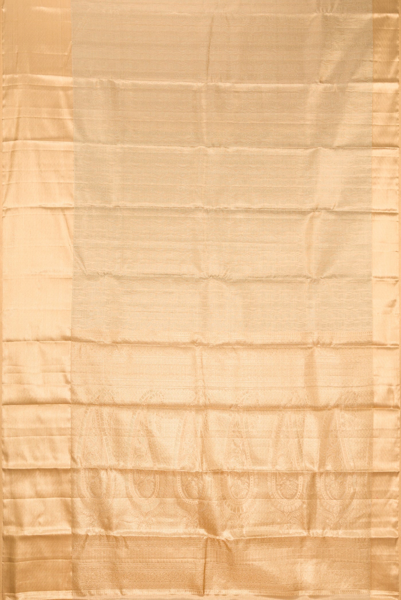 Gold Dual Tone Kanchipuram Tissue Silk Saree with Zari Brocade on the body and Fancy Border.  displayed on a mannequin