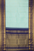 Pista Green Dual Tone Kanchipuram Silk Saree with Zari Butta on the body and Fancy Border.  displayed on a mannequin