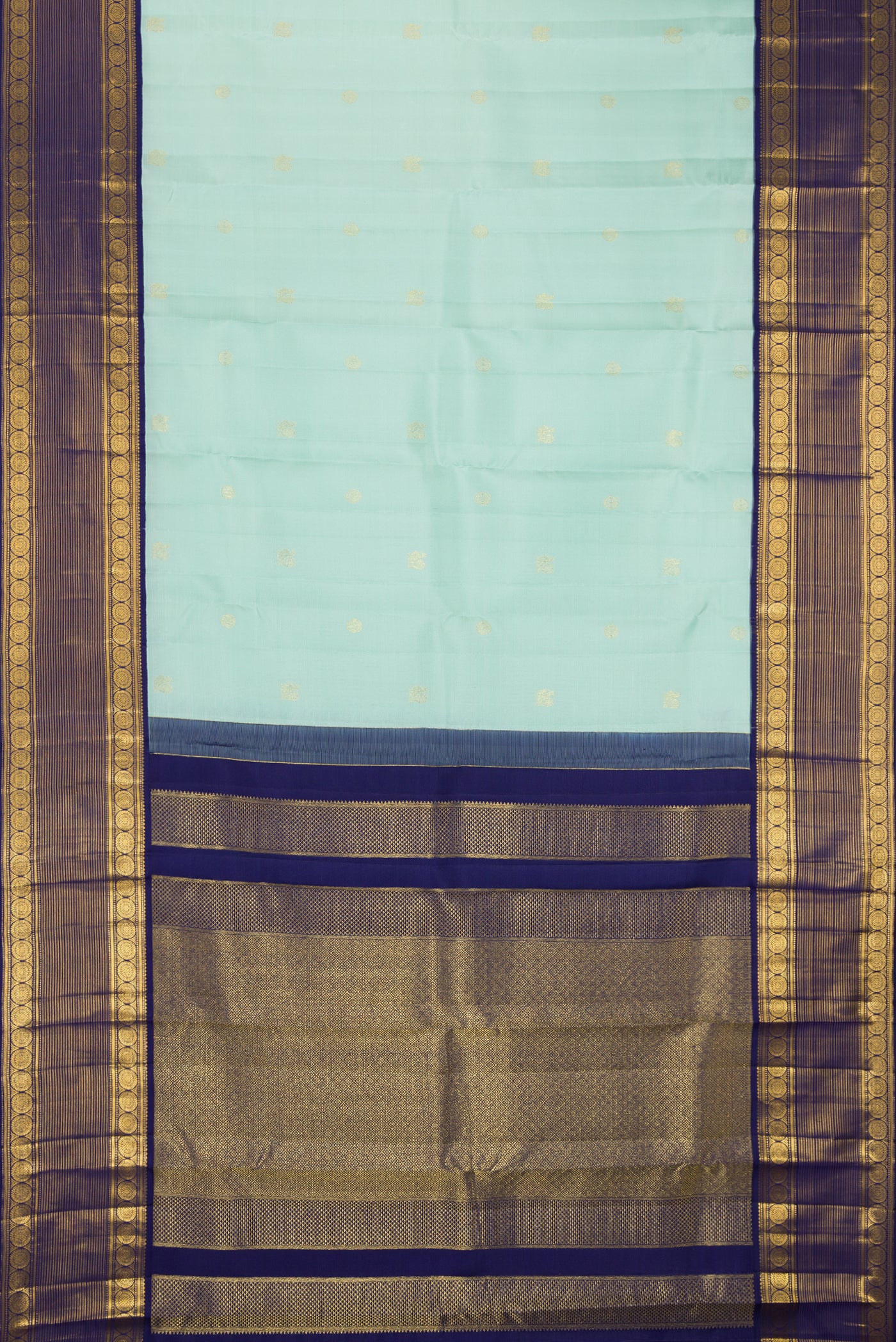 Pista Green Dual Tone Kanchipuram Silk Saree with Zari Butta on the body and Fancy Border.  displayed on a mannequin