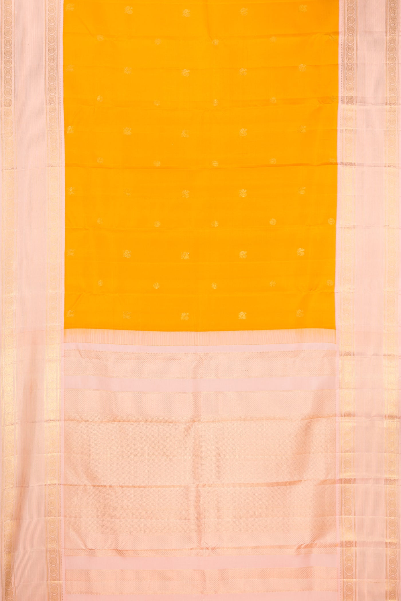 Mustard Dual Tone Kanchipuram Silk Saree with Zari Butta on the body and Fancy Border.  displayed on a mannequin