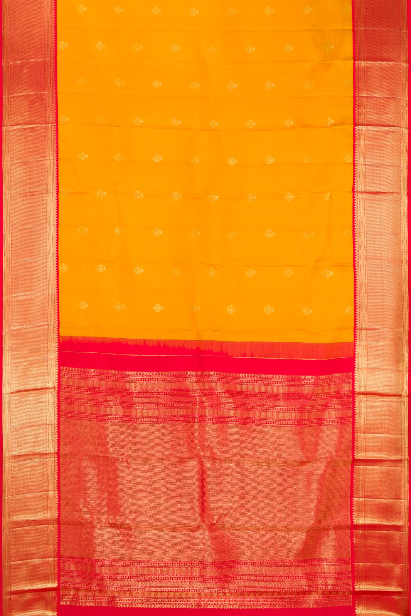 Mustard Dual Tone Kanchipuram Silk Saree with Zari Butta on the body and Fancy Border.  displayed on a mannequin
