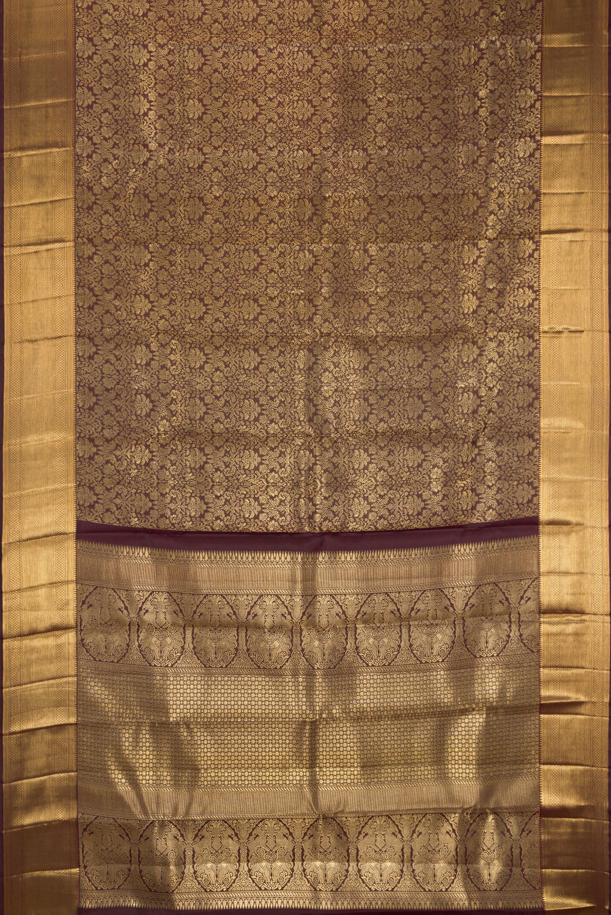 Coffee Brown Dual Tone Kanchipuram Silk Saree with Zari Brocade on the body and Zari Border.  displayed on a mannequin