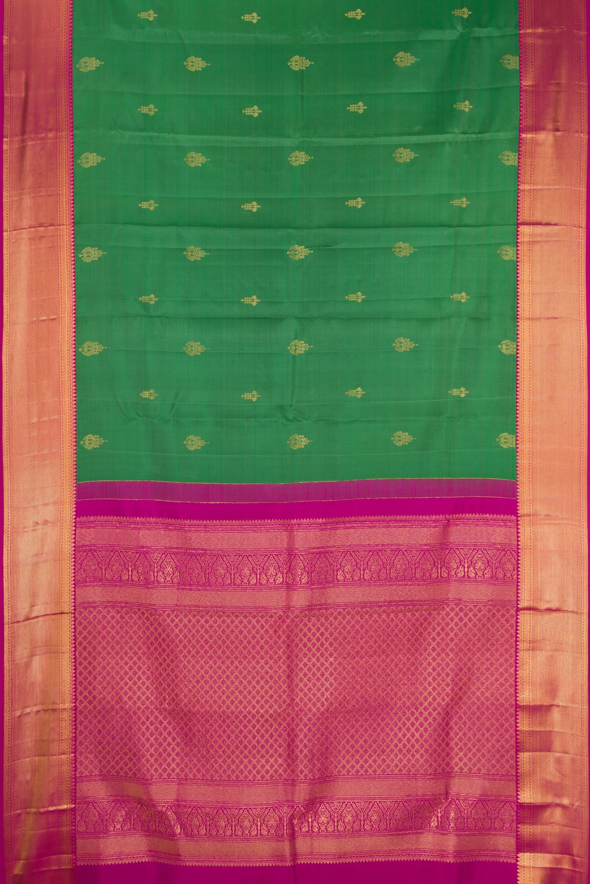 Green Dual Tone Kanchipuram Silk Saree with Zari Butta on the body and Zari Border.  displayed on a mannequin